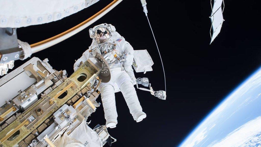 Astronaut takes a spacewalk