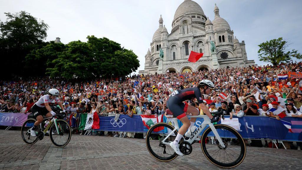 Pfeiffer Georgi (right) riding over the top of the Monmarte climb during the Olympic Games road race in Paris