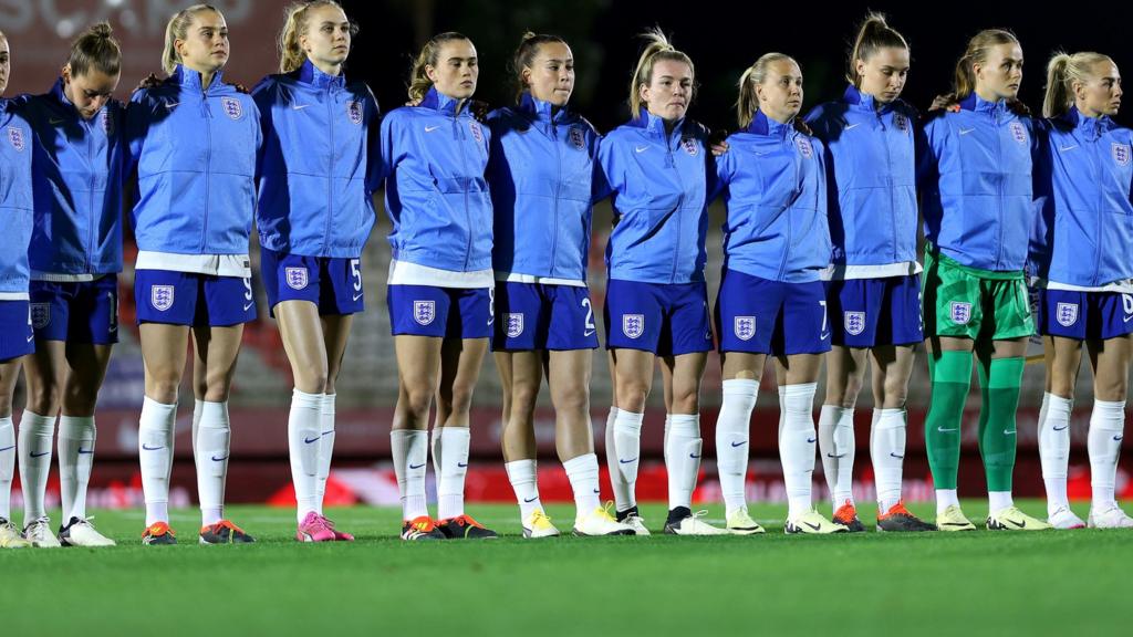 England players line up before kick-off