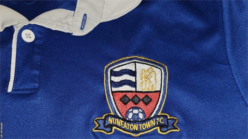 Nuneaton Town badge on former shirt