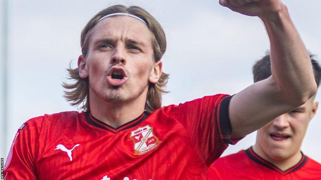 Ronan Darcy celebrates his final goal for Swindon