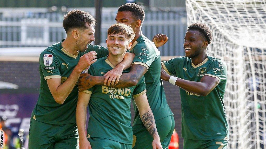 Luke Cundle celebrates his goal with his Plymouth team-mates