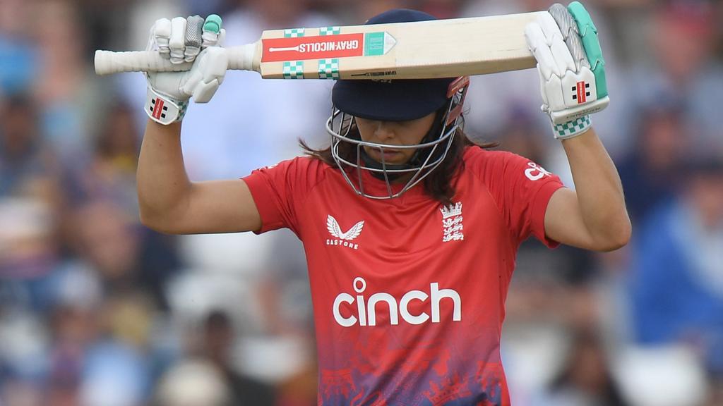 England batter Maia Bouchier puts her bat on her helmet in frustration after being dismissed