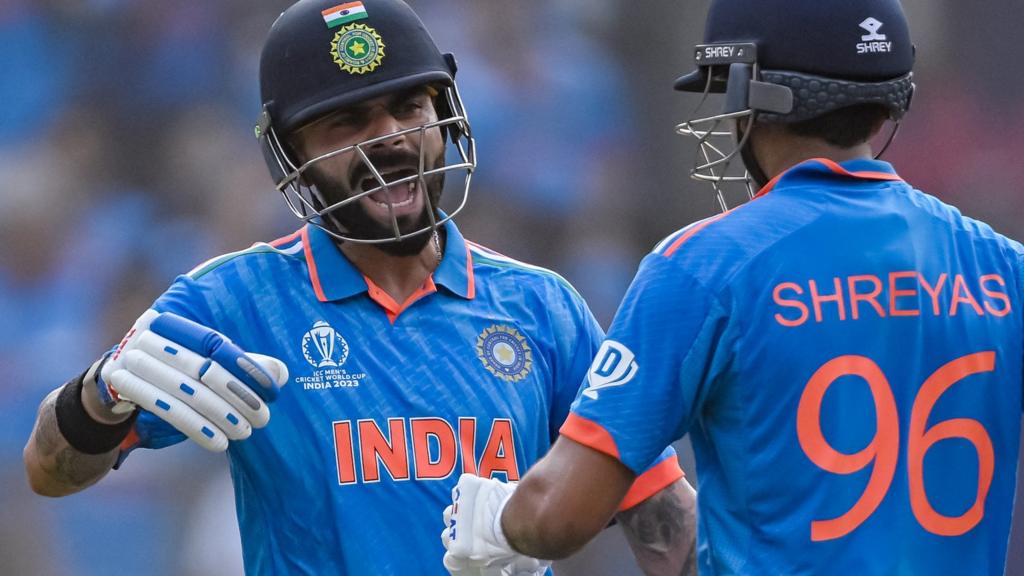 India's Virat Kohli (left) and Shreyas Iyer (right) greet each other