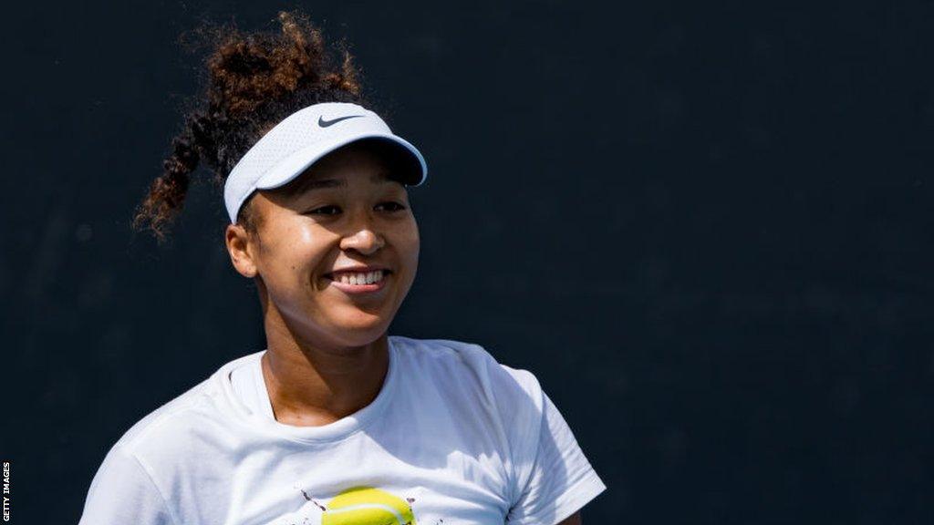 Naomi Osaka smiles during a practice session at the Australian Open