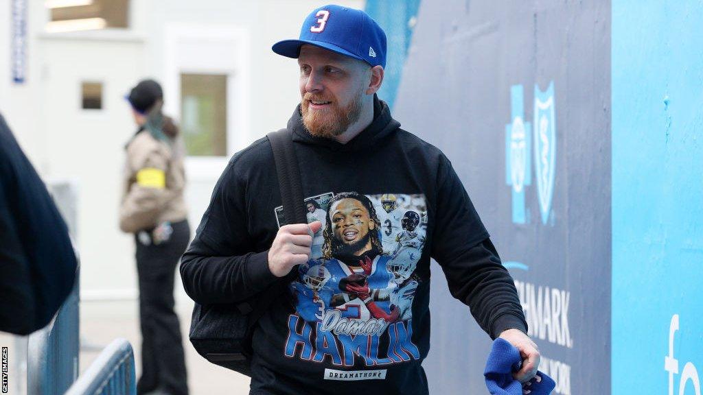 Buffalo Bills player Cole Beasley arrives at the game wearing a Damar Hamlin T-shirt and cap