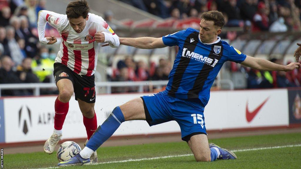 Conor Masterson (right) in action for Gillingham