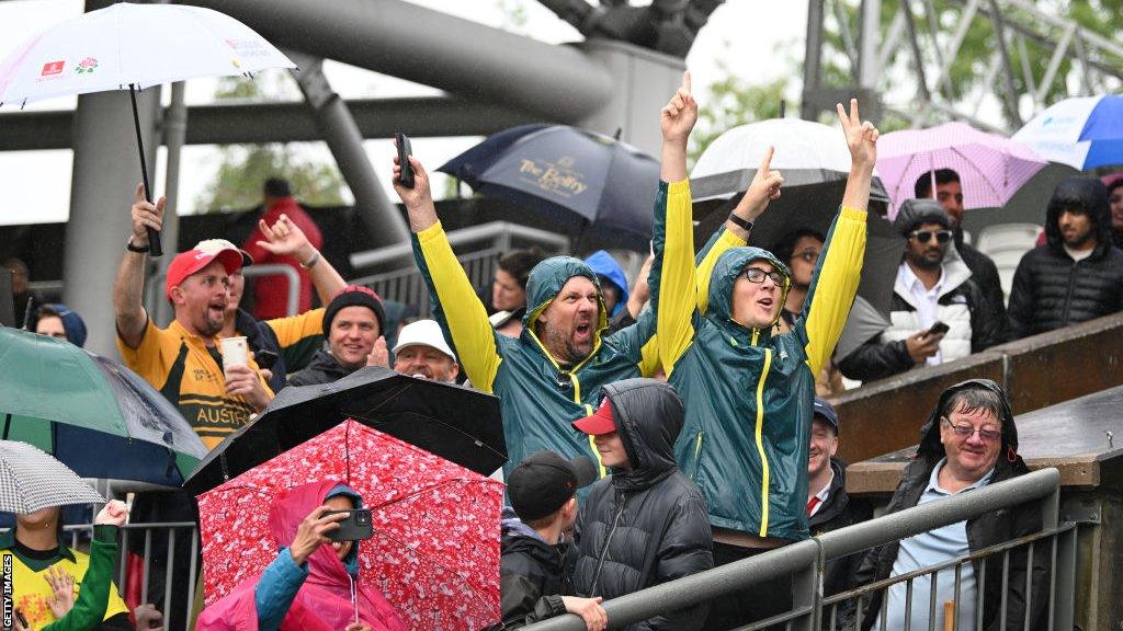 Australia fans celebrating after the Old Trafford Test was abandoned, meaning Australia retained the Ashes