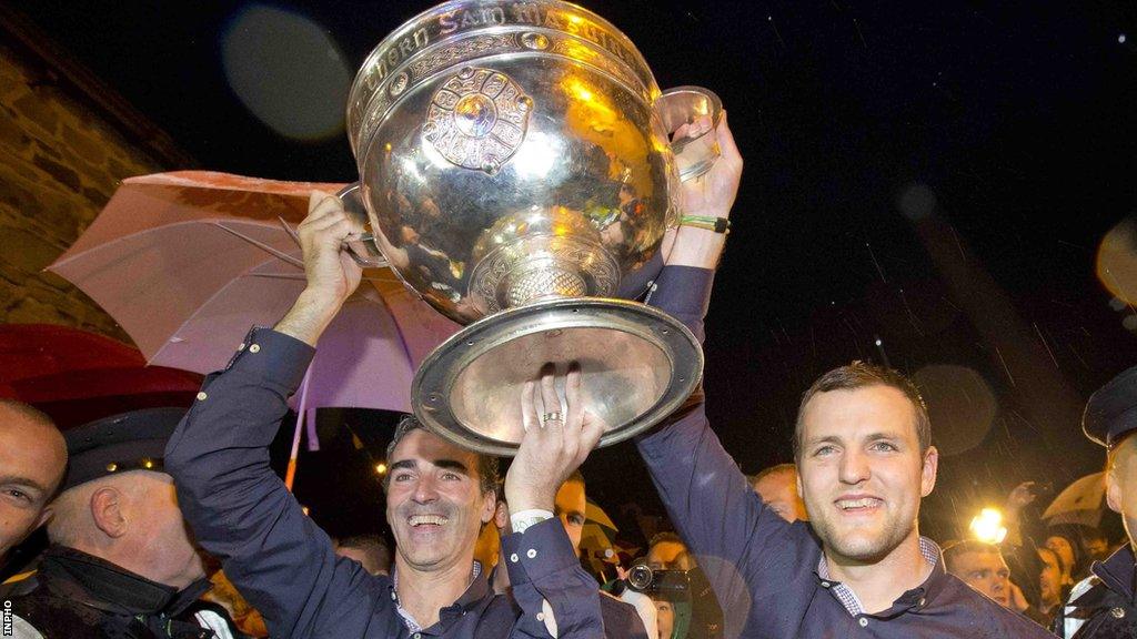 Jim McGuinness and Michael Murphy carry the Sam Maguire Cup in Donegal in 2012