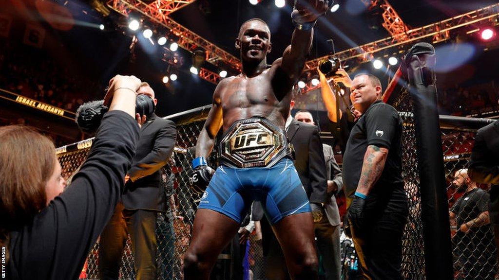 Israel Adesanya celebrates following victory over Alex Pereira