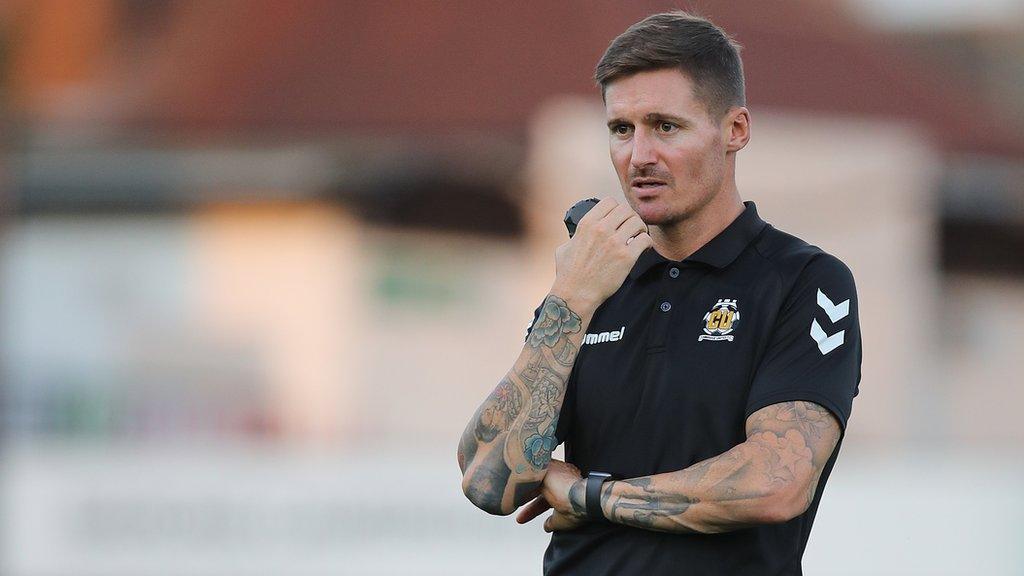 Barry Corr watches training at Cambridge United