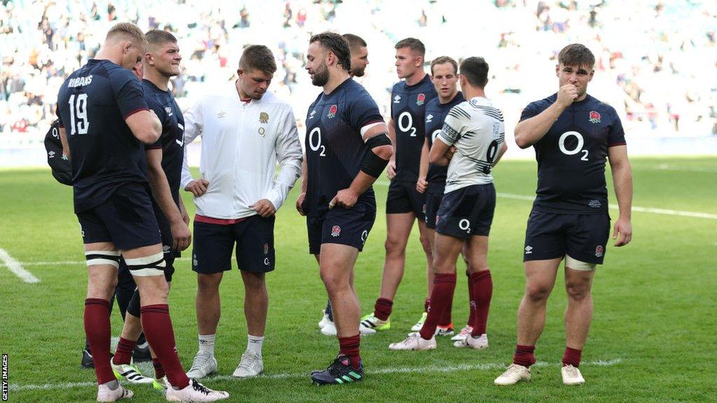 England players look dejected following their 30-22 defeat by Fiji