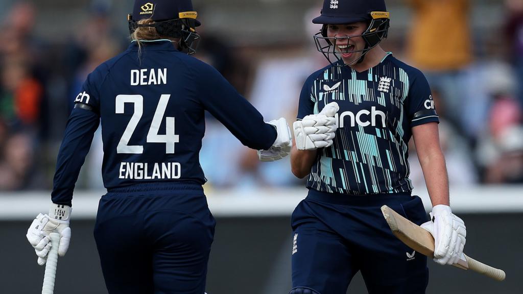 England batter Alice Davidson-Richards (right) celebrates her fifty with Charlie Dean (left)