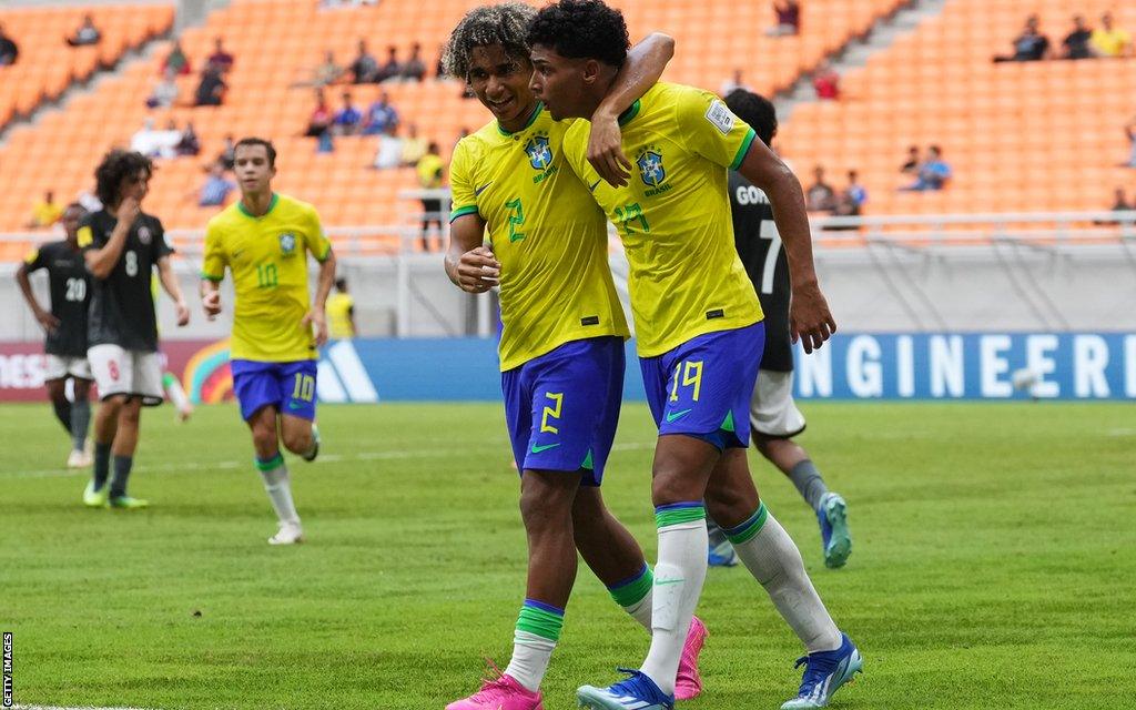 Brazil players celebrate after scoring