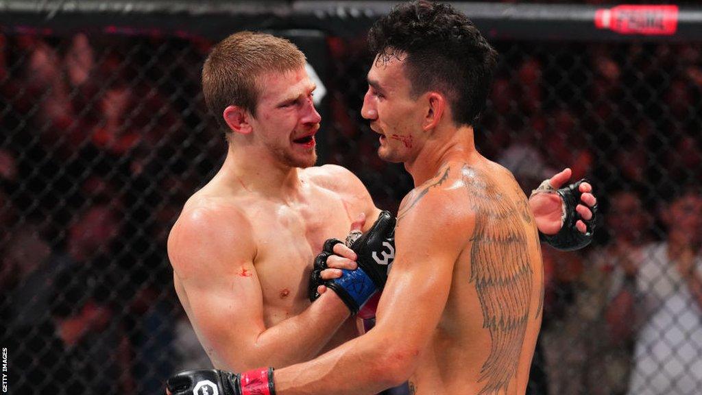 Arnold Allen and Max Holloway embrace after their fight