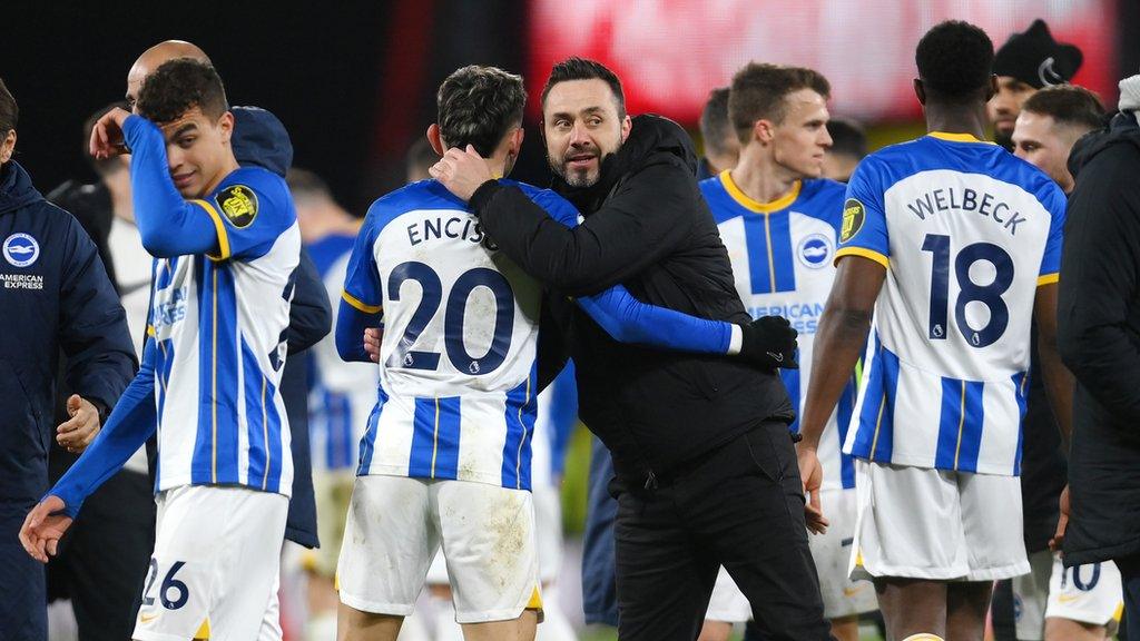 Roberto de Zerbi hugs Brighton players after match