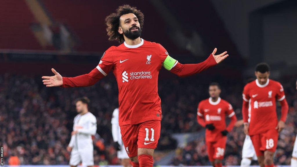 Mohamed Salah celebrates scoring for Liverpool in the Europa League