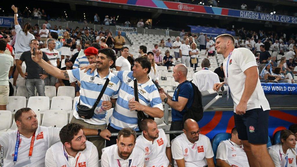 Owen Farrell poses with Argentina fans before the teams' World Cup opener