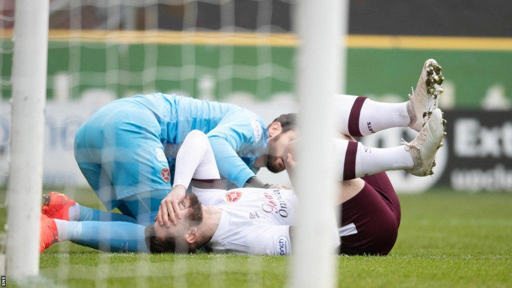 Heart of Midlothian goalkeeper Craig Gordon and centre-half Craig Halkett down injured