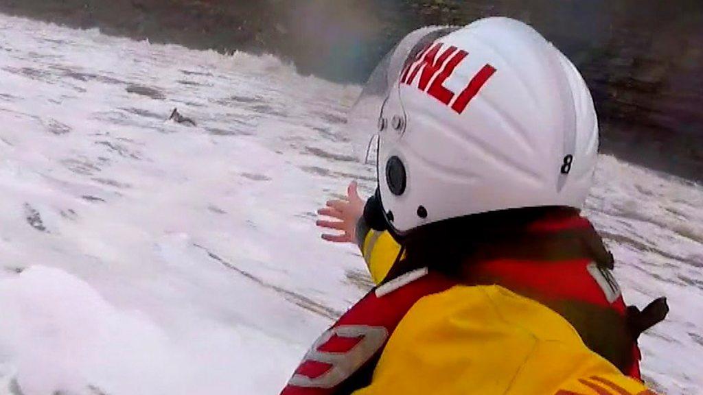 Several attempts to reach the stranded surfer were thwarted by powerful breaking waves.