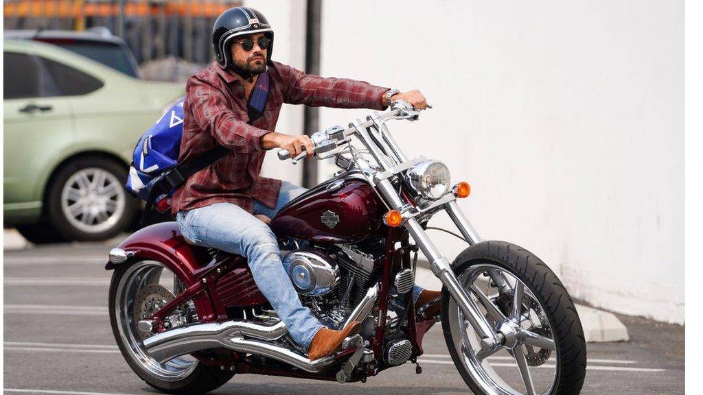 Actor Jesse Metcalfe riding a Harley-Davidson