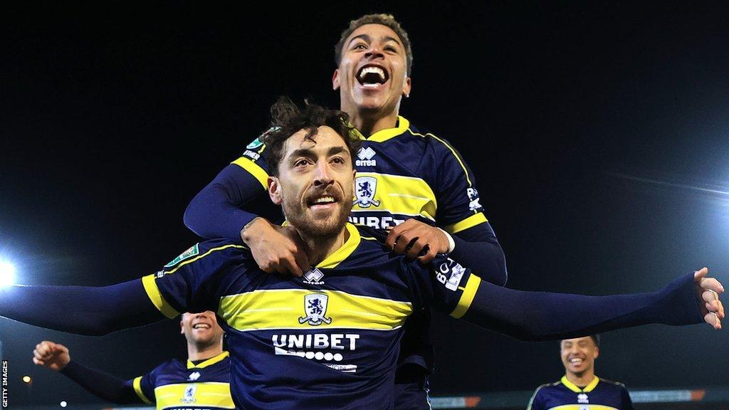 Matt Crooks is jumped on by Morgan Rogers as he celebrates his cup tie goal against Port Vale