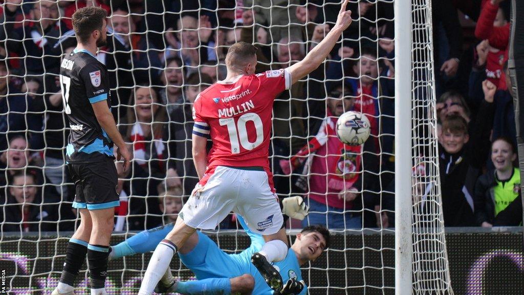 Paul Mullin celebrates scoring Wrexham's second goal against Rovers