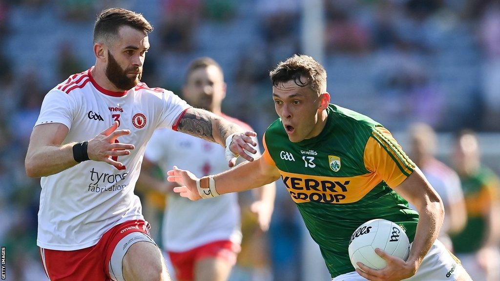 David Clifford fends off Ronan McNamee during the 2021 semi-final between Tyrone and Kerry