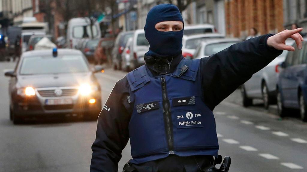 Police at the scene of a security operation in the Brussels suburb of Molenbeek in Brussels, Belgium, March 18, 2016.