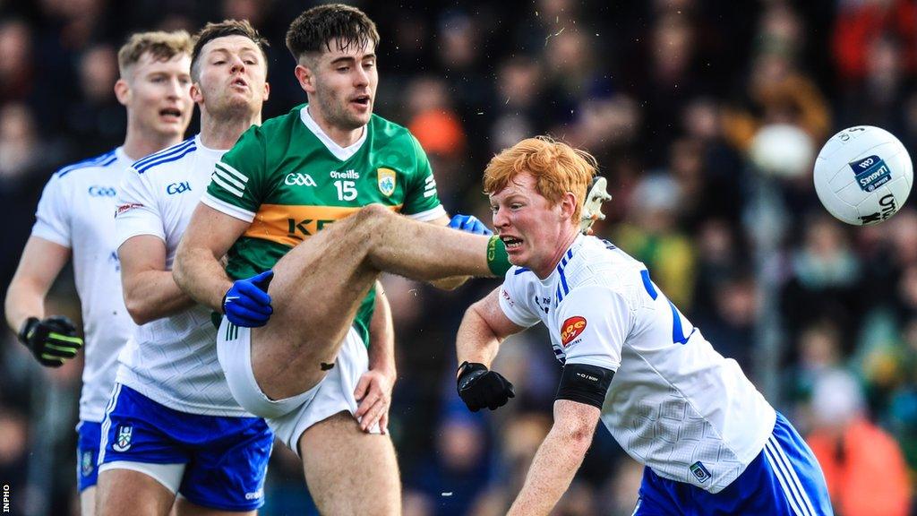 Kerry corner forward Donal O'Sullivan gets in a shot despite the efforts of Monaghan's Ryan O'Toole