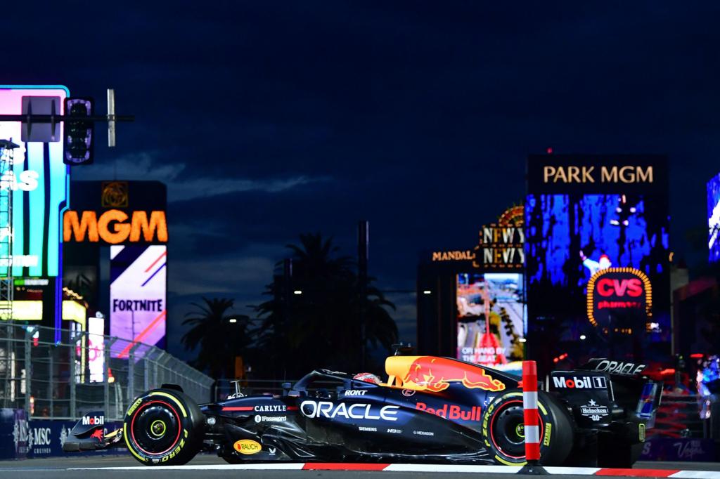 Red Bull's Max Verstappen with high-rise buildings and neon lights in the background during Las Vegas Grand Prix first practice