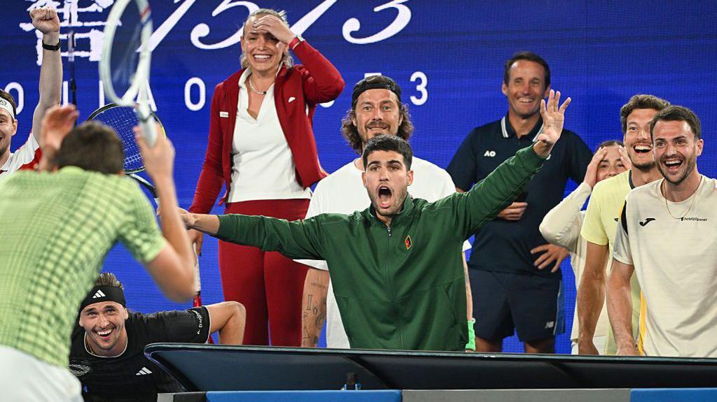 Carlos Alcaraz and fellow players react after Daniil Medvedev loses a point at the Million Dollar One Point Slam