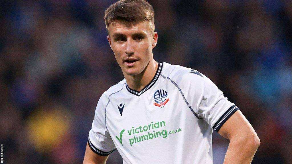 George Thomason in action for Bolton