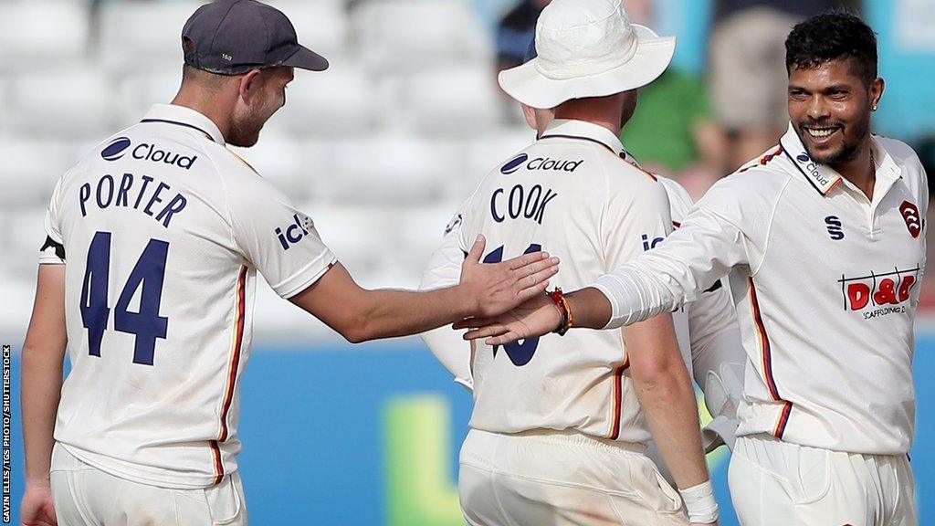 Umesh Yadav is congratulated on taking a wicket by new team-mate Jamie Porter