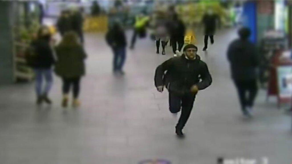 A man in a CCTV image running