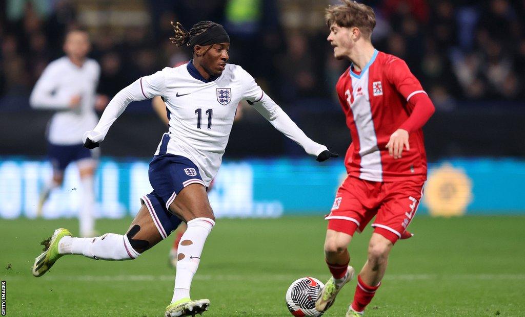 Noni Madueke takes on a defender