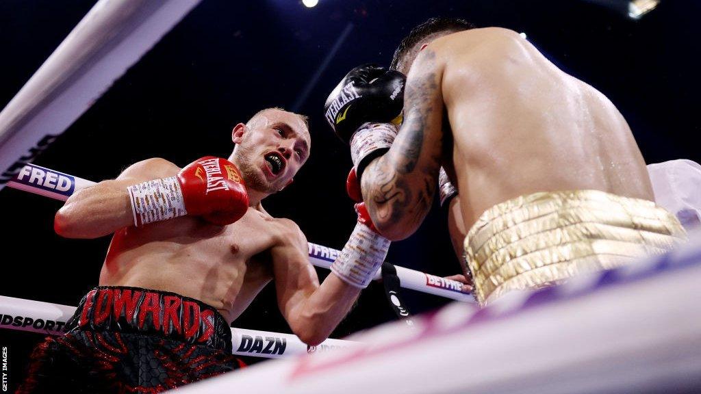 Sunny Edwards punches his opponent on the ropes