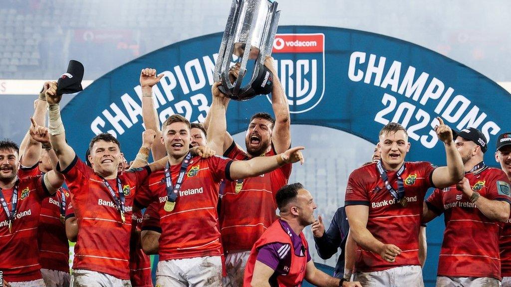 Munster players celebrate with the United Rugby Championship title