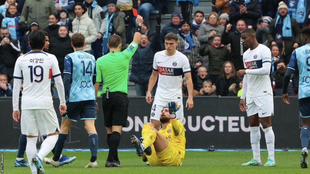 Gianluigi Donnarumma reacts after being sent off