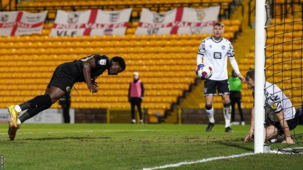 Ephron Mason-Clark heads Peterborough's opening goal