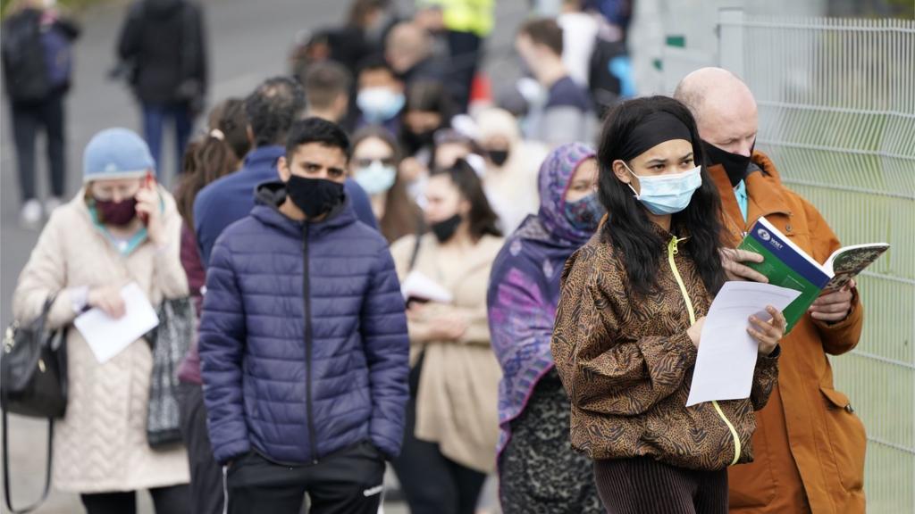 People queuing for a vaccine in Bolton