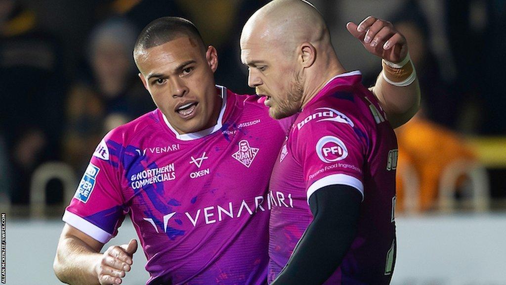 Adam Swift and Tui Lolohea celebrate a Huddersfield try