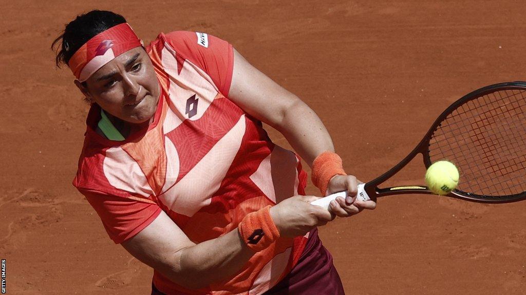 Ons Jabeur hits a return against Lucia Bronzetti at the 2023 French Open