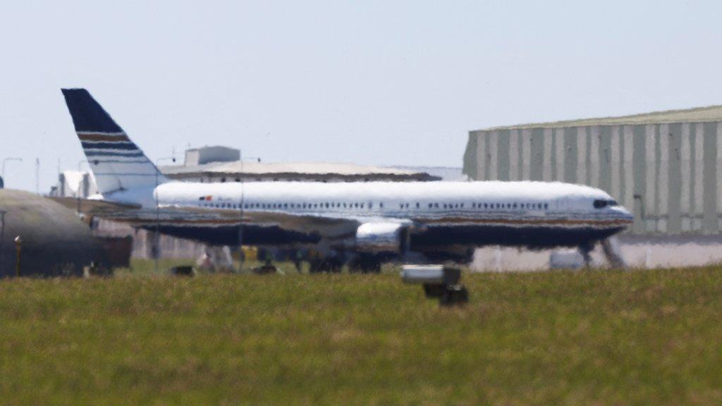 The plane thought to be first to transport migrants to Rwanda is seen on the tarmac at MOD Boscombe Down base in Wiltshire on Tuesday