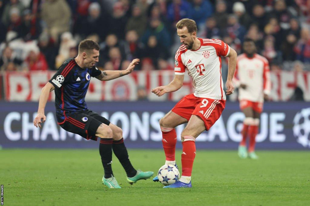 Lukas Lerager (left) battles with Harry Kane (right) for the ball