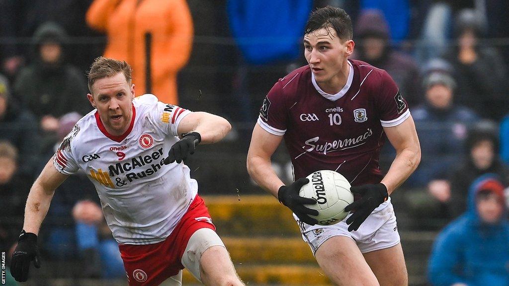 Matthew Tierney of Galway in action against Frank Burns of Tyrone