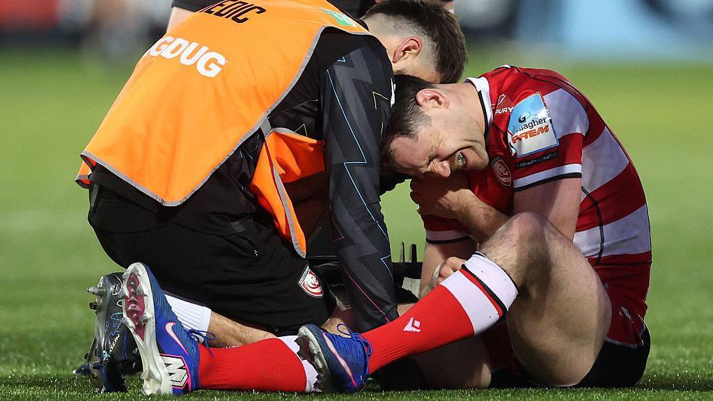 Tomos Williams of Gloucester reacts after picking up an injury against Sale Sharks 