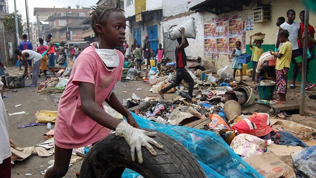 Girl in Sierra Leone taking part in national cleaning day