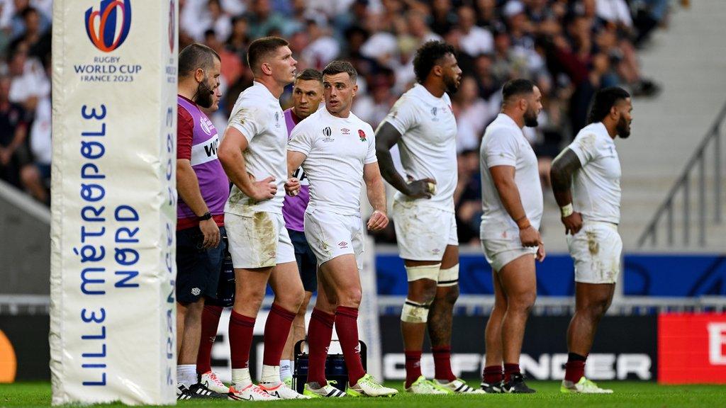 England players stood next to goalposts