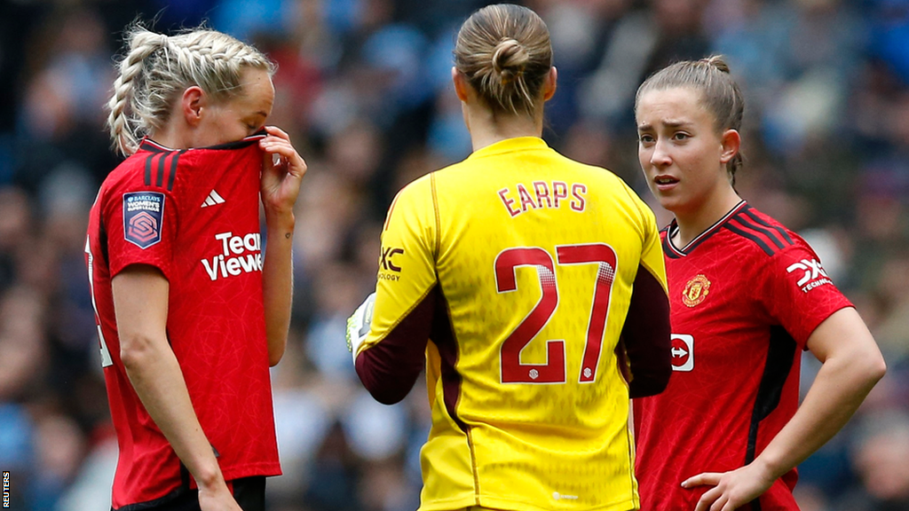 Manchester United's players react during their team's 3-1 defeat away at Manchester City in the Women's Super League